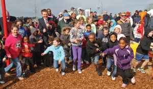 The ribbon cutting for a revitalized park delighted children and mayor alike.