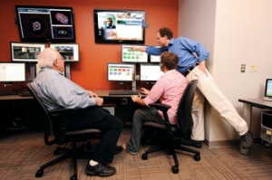 Top: Data from Large Hadron Collider experiments are monitored 24/7  in Stevenson’s virtual control center. Middle: Victoria Greene. Bottom: Vanderbilt physicists communicate with researchers around the world.