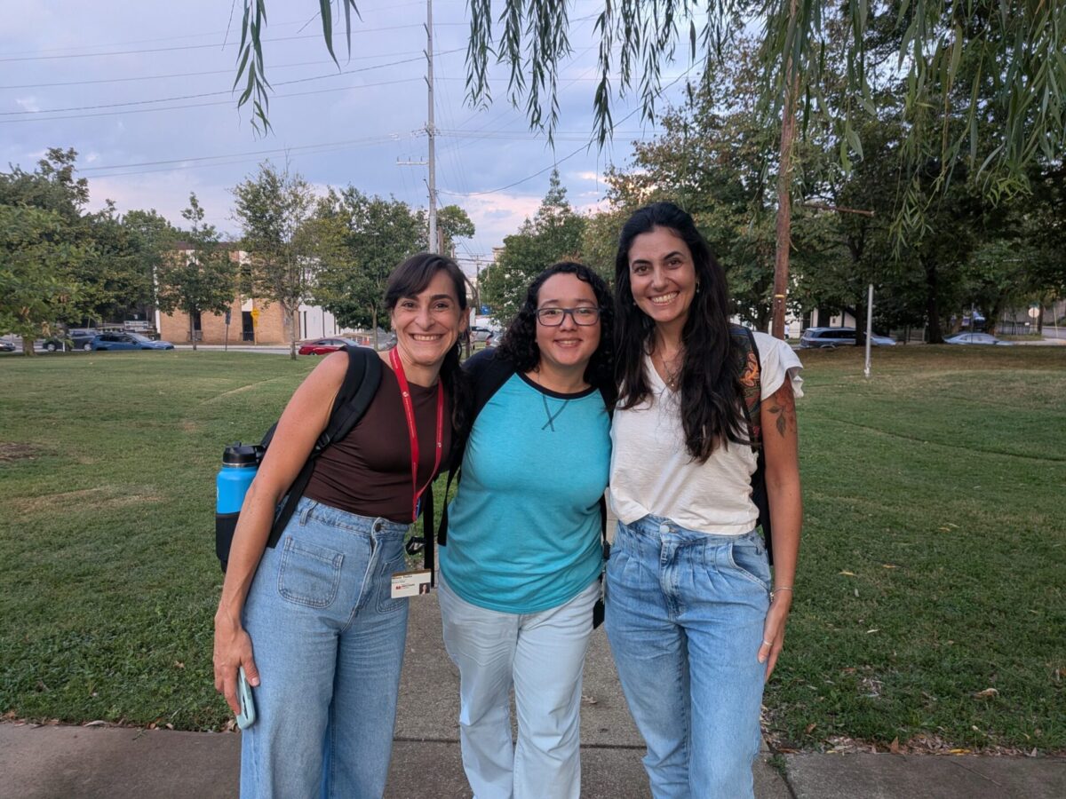 Three postdocs in a park. 