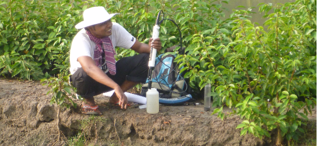 Water samples collected from tube wells and ponds are tested using a Hydrolab instrument.