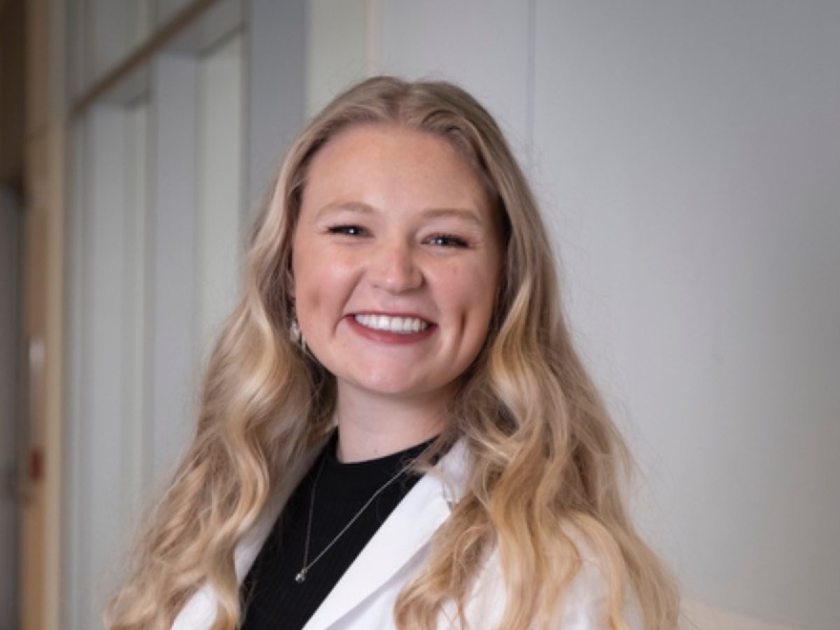 Blonde woman wearing white VU Medicine lab coat
