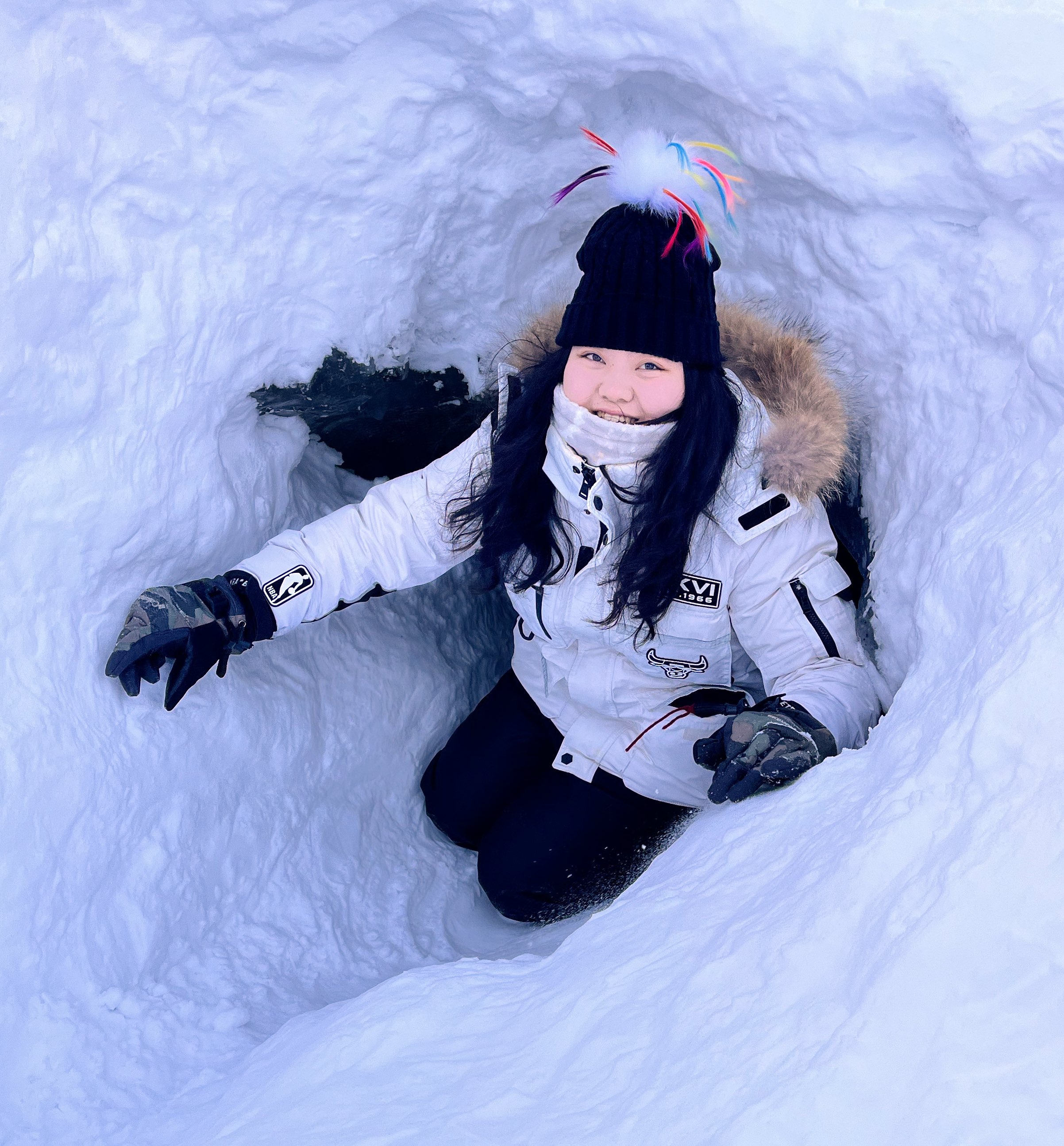 A woman in a snow bank