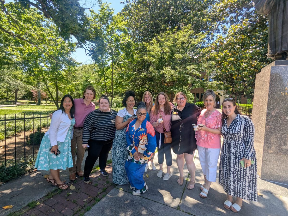 Staff members enjoying a cold treat on a summer day. 