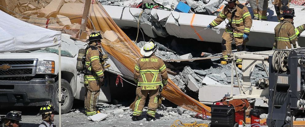 PHOTO: Miami-Dade Fire Rescue Department personnel and other rescue units work at the scene where a pedestrian bridge collapsed a few days after it was built on the Florida International University, March 15, 2018, in Miami. 