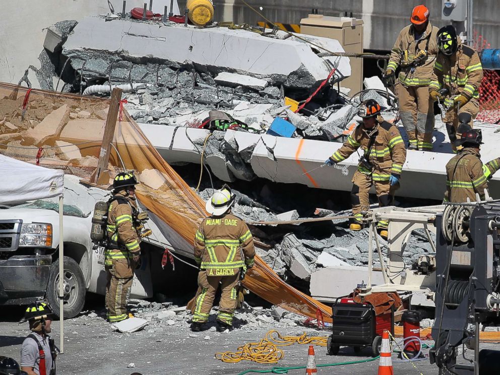 PHOTO: Miami-Dade Fire Rescue Department personnel and other rescue units work at the scene where a pedestrian bridge collapsed a few days after it was built on the Florida International University, March 15, 2018, in Miami. 