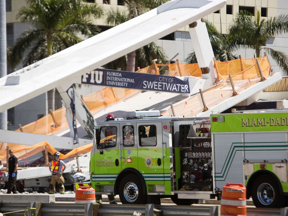 PHOTO: Emergency personnel responds to a collapsed pedestrian bridge connecting Florida International University on March 15, 2018 in the Miami area.