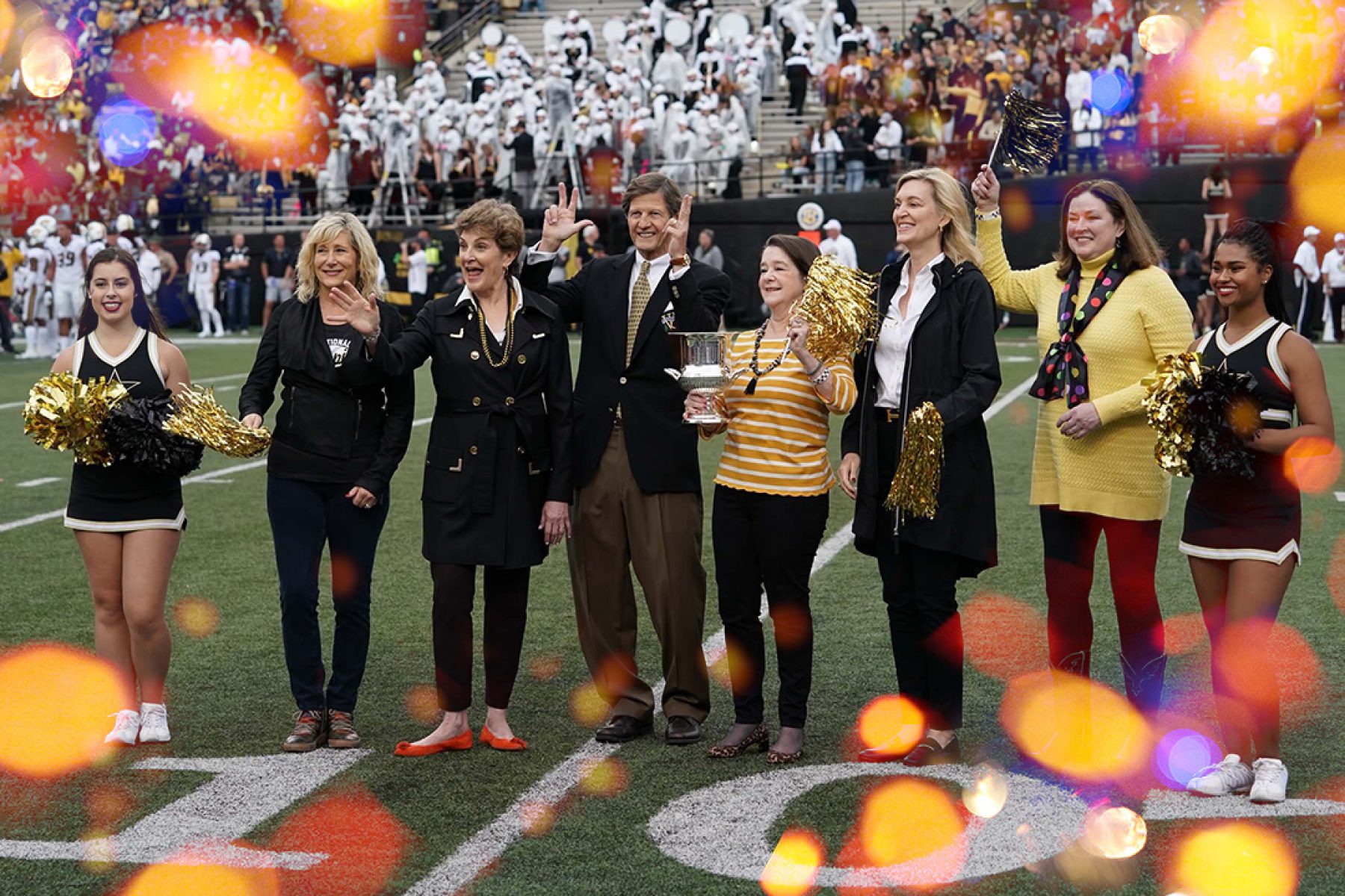 Photo of alumni at football game